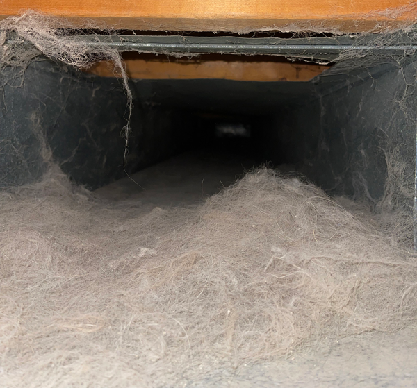 Dusty duct with accumulated debris