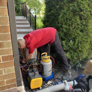 Man working on outdoor equipment