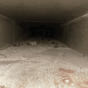 ductwork buildup before inside a very dirty duct for an HVAC system in London, Ontario