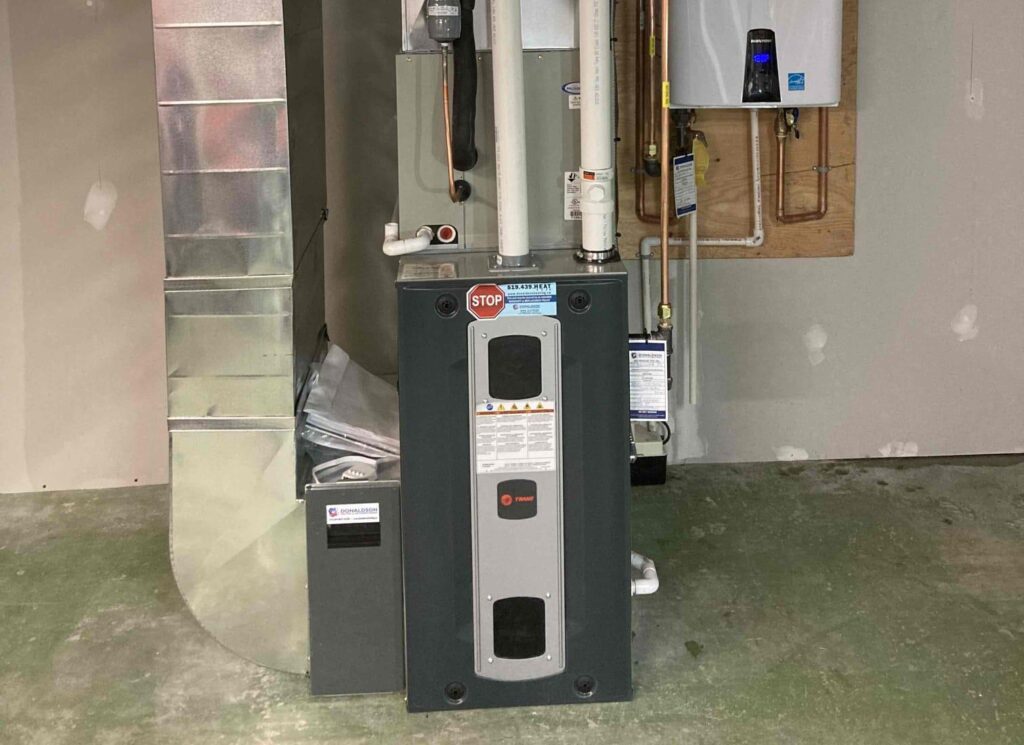 Best HVAC brands. Trane furnace installed by Donaldson Home Service in London, Ontario with tankless water heater installed
