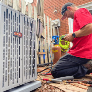 Donaldson technician installing a Trane Air Conditioner outside of London, Ontario home.