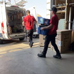 Donaldson technician servicing home comfort equipment indoors.