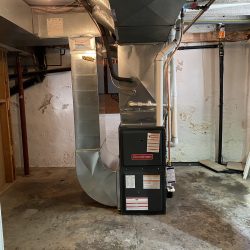 Installed residential furnace in a utility area.